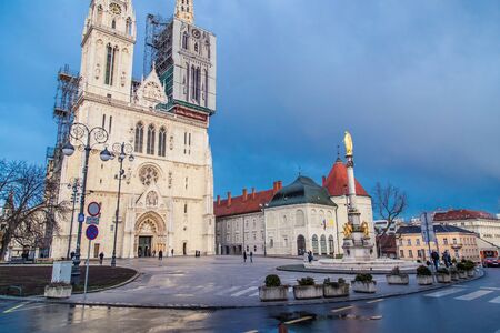 ZAGREB, CROATIA - 11 MARCH 2015: The Zagreb Cathedral with locals and tourist in front of it.のeditorial素材