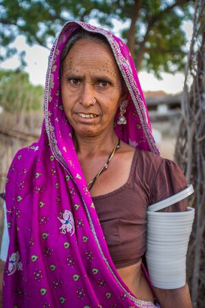 GODWAR REGION, INDIA - 12 FEBRUARY 2015: Tribeswoman decorated with traditional tattoos on face, jewelry and upper arm bracelets. Rabari or Rewari are an Indian community in the state of Gujarat.のeditorial素材