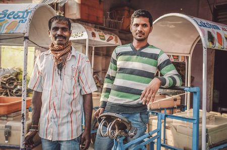 KAMALAPURAM, INDIA - 02 FABRUARY 2015: Indian ice-cream vendors on a market close to Hampi. Post-processed with grain, texture and colour effect.のeditorial素材