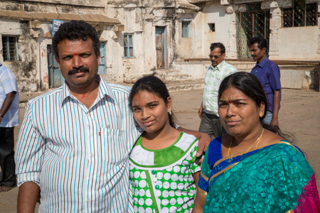 HAMPI, INDIA - 28 JANUARY 2015: Father, mother and daughter visiting the old city as tourists.のeditorial素材