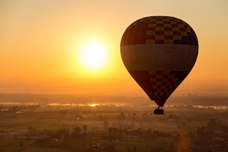 Hot air ballooning  over the Valley of the Kings and Nile river.の写真素材