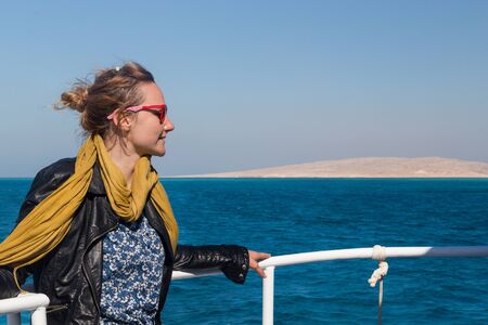 Young woman enjoying a ride on tourist boat at Red Sea.の写真素材