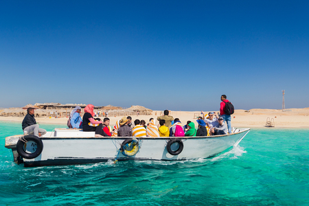 PARADISE ISLAND, EGYPT - FEBRUARY 12: Tourists on dive boat going snorkeling on Paradise Island.のeditorial素材