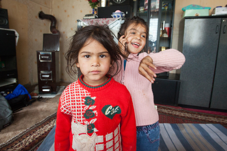 ZAGREB, CROATIA - OCTOBER 21, 2013: Portrait of little Roma girls at their home.のeditorial素材