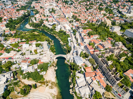 Aerial view of city of Mostar in Bosnia and Herzegovina and it's landmarks (Neretva river, Old bridge, Koski Mehmed Pasha Mosque).のeditorial素材