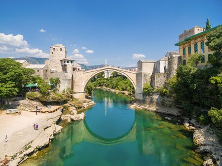 People at Old Bridge over Neretva river in Mostar, Bosnia and Herzegovina.のeditorial素材