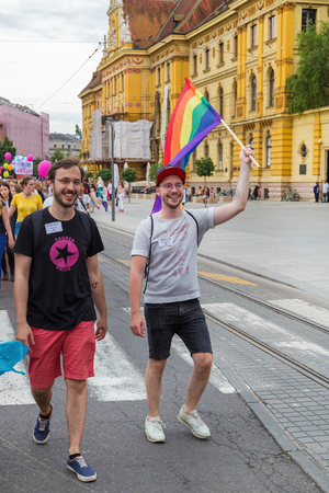 ZAGREB, CROATIA - JUNE 11, 2016: 15th Zagreb pride. LGBTIQ activist holding flag.のeditorial素材