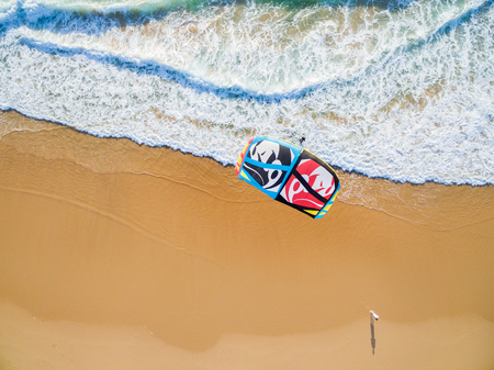 PRAIA DA GUINCHO BEACH, PORTUGAL - MAY 23, 2017: People kitesurfing at popular blue flag Guincho...