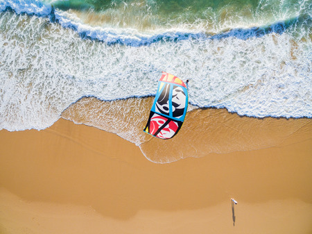 PRAIA DA GUINCHO BEACH, PORTUGAL - MAY 23, 2017: People kitesurfing at popular blue flag Guincho beach.のeditorial素材