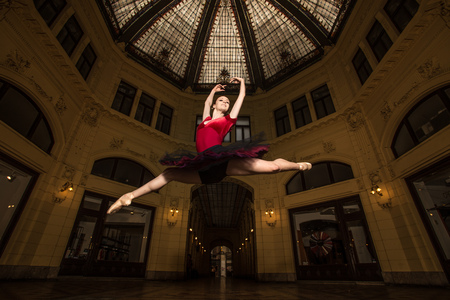 Ballerina Natalia Horsnell doing a split jump in the Oktogon public urban passageway in Zagreb, Croatia.の写真素材