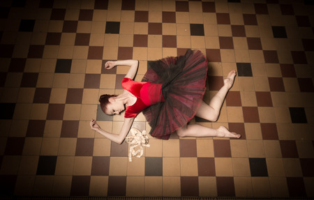 Ballerina Natalia Horsnell posing on the floor in the Oktogon public urban passageway in Zagreb, Croatia.の写真素材