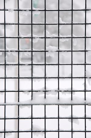 Grid covered in snowの写真素材