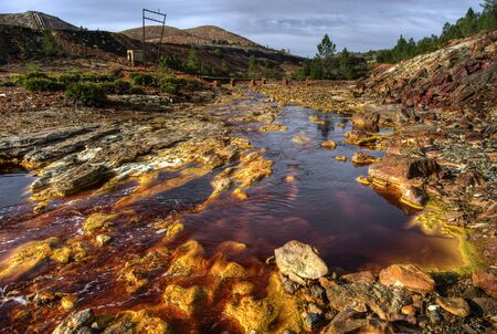 riotinto river with red waters produced by the copper miningの写真素材