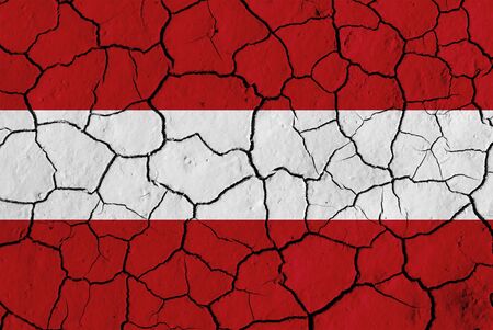 Flag of Austria over cracked background, conceptual image of crisisの写真素材