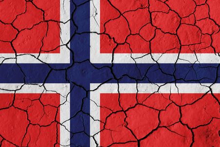 Flag of Norway over cracked background, conceptual image of crisisの写真素材