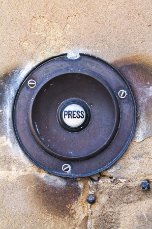 Traditional brass door bell with ceramic Pushの写真素材