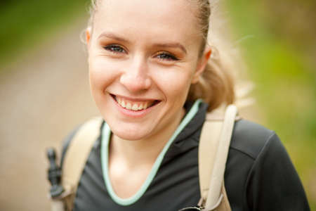outdoor portrait of young beautiful woman while hikingの写真素材