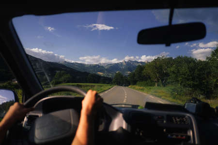 driver driving in the mountains in italy, dirver is not in focus