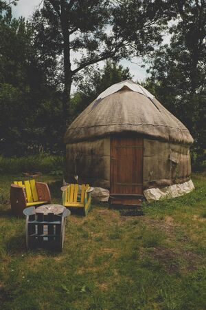outside of a handmade yurt (tent) in the camp for people with alternative lifestyleの写真素材