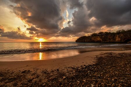 sunset at a natural beach in the caribbeanの写真素材