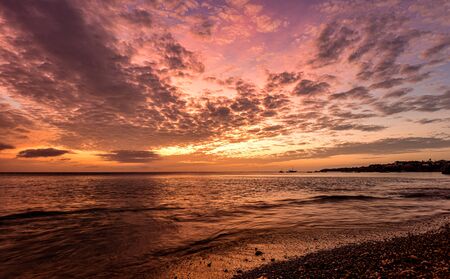 burning sky at sunset in the caribbeanの写真素材