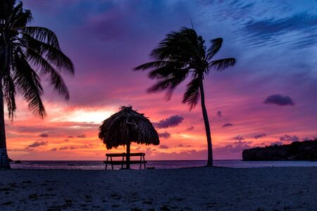 magical sunset at the beach in curacaoの写真素材