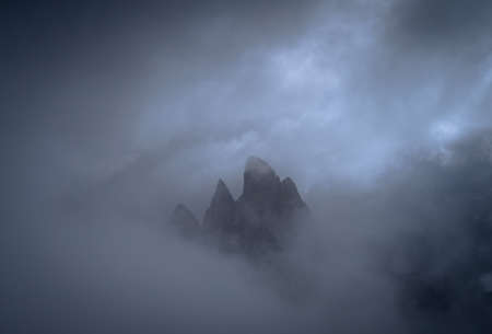 Seceda mountain peak covered in cloudsの写真素材