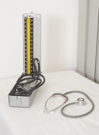 Medical blood pressure gauge and doctors stethoscope on a white backgroundの写真素材