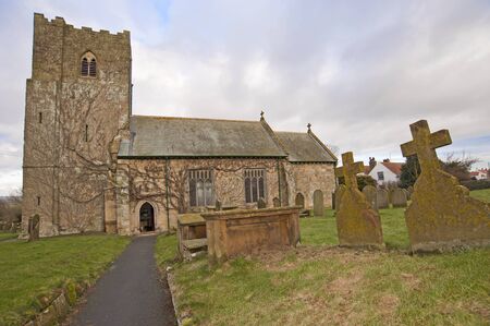 Church and graveyard in an english countryside communityの写真素材