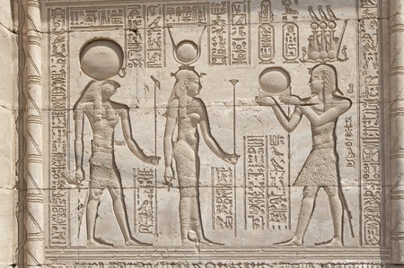 Hieroglyphic carvings on the exterior walls of an ancient egyptian templeの写真素材