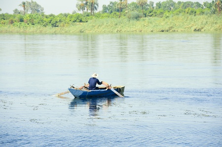 Local Egyptian fisherman in a rowing boat on the River Nile