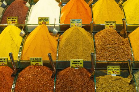 Various spices on display at an indoor market stallのeditorial素材