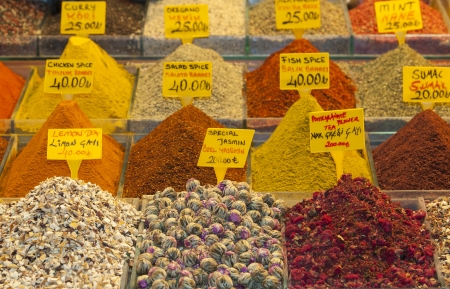 Various spices on display at an indoor market stall