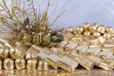Display showing collection of festive style chocolate sweets with ornate decorationの写真素材