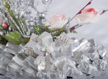 Display showing collection of festive style chocolate sweets with ornate decorationの写真素材