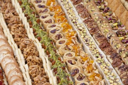 Selection of luxury oriental petit fours in rowsの写真素材