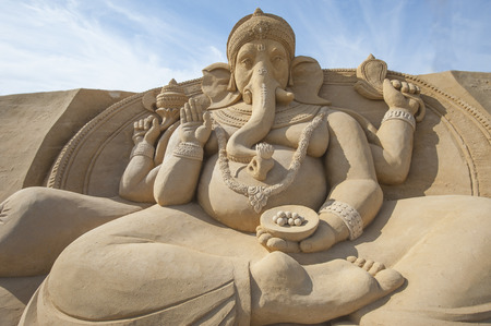 Large sand sculpture of the Hindu god Ganesh at sand city theme parkの写真素材