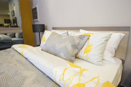 Bedroom area in show home with mirror wardrobe and lamps