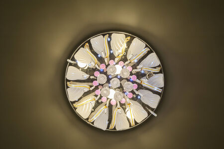 Ornate chandelier style ceiling light inside luxury apartment