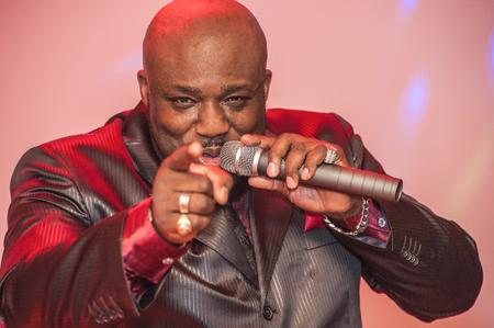 African male singer giving a live soul singing performanceの写真素材