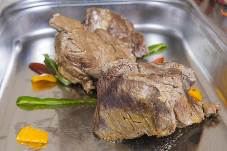 Two chunks of roast beef on display at a hotel restaurant buffetの写真素材
