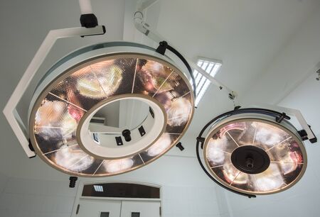 High powered circular surgery lights in a hospital operating roomの写真素材