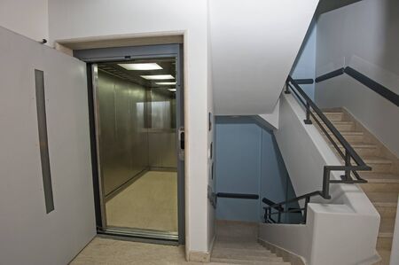 Interior of a large building with lift and staircase