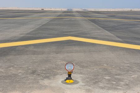 Row of approach lights off the end of an airfield airport runway