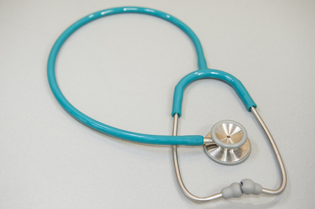 Doctors stethoscope isolated on a grey backgroundの写真素材