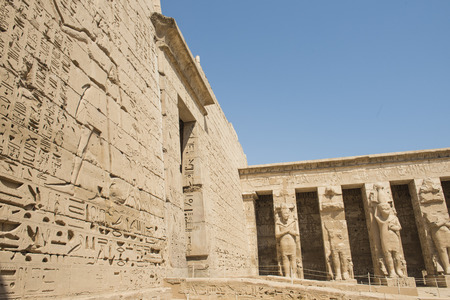 Statues of a pharaoh at the temple of Medinat Habu courtyard in Luxor