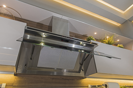Interior design decor of modern kitchen showing extractor fan appliance in luxury apartment showroomの写真素材