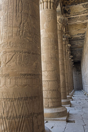 Hieroglypic carvings on wall and columns at the ancient egyptian temple of Horus in Edfuの写真素材