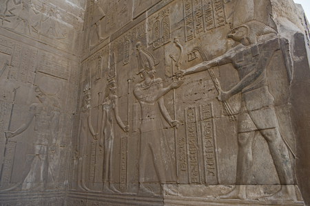 Hieroglypic carvings on wall at the ancient egyptian temple of Kom Ombo