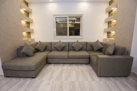 Living room lounge sofa in luxury apartment show home showing interior design decor furnishingの写真素材
